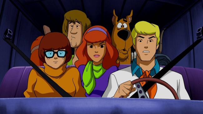 Die Scooby-Doo-Crew der Zeichentrickserie in ihrem Einsatzbus Die Scooby-Doo-Crew der Zeichentrickserie in ihrem Einsatzbus