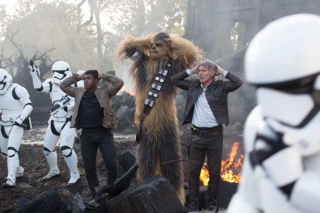 Finn (John Boyega), Chewbacca (Peter Mayhew), and Han Solo (Harrison Ford)